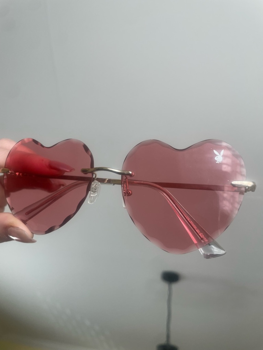 PLAYBOY Heart-Shaped Rimless Sunglasses in Translucent Pink